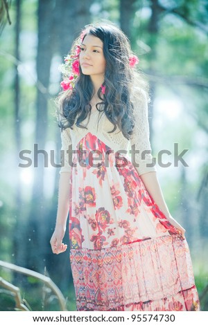 Young Girl in Red Flowery Dress in Enchanted Forest
