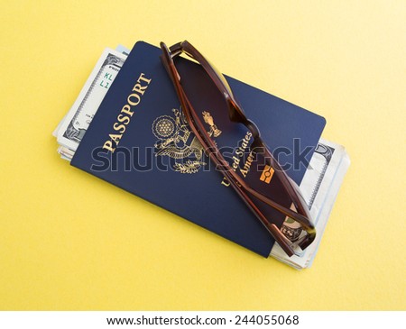A United States Passport, sunglasses and vacation cash atop a yellow background.