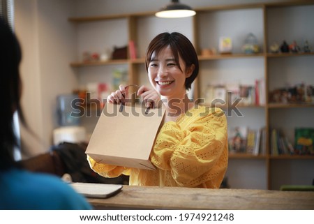 Image of a woman receiving a product  Сток-фото © 