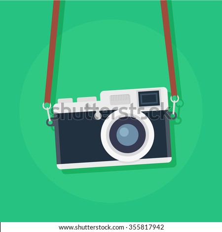 Retro camera in a flat style on a colored background. Old camera with strap. 