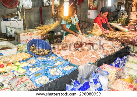 Chiang Mai, Thailand - July 29, 2011: People selling food in the famous Sunday night market in town.