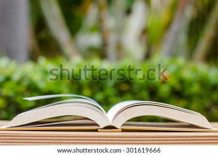 open book on wood texture in nature