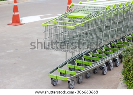Abstract of the green Shopping carts at the parking rot
