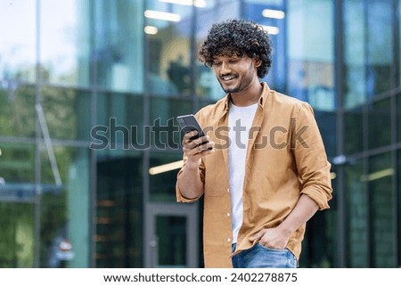 Similar – Image, Stock Photo Man walking down a staircase between two imposing buildings