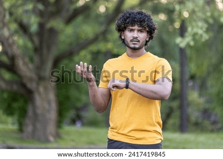 Similar – Image, Stock Photo Ethnic sportsman using tracker on street