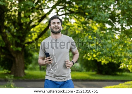 Similar – Image, Stock Photo Ethnic sportsman in headphones getting ready for running