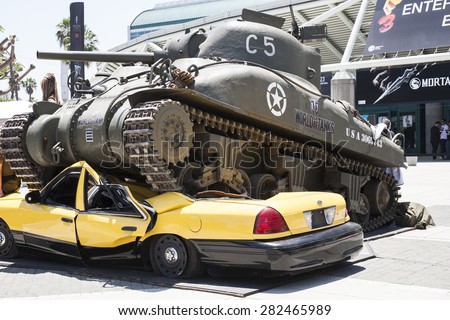 The video game World of Tanks created a display featuring a replica of a World War 2 tank crushing a taxi cab outside E3 (Electronic Entertainment Expo), in Los Angeles, California, June 2014.