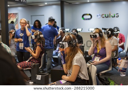 E3; The Electronic Entertainment Expo at the Los Angeles Convention Center, June 16, 2015. Los Angeles, California. A group of women experience virtual reality at the Oculus booth at E3..