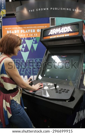 July 10, 2015: San Diego Comic Con, the annual pop culture and fandom convention in San Diego, California. Web Series host Meredith Placko plays a demo of a video game at the Ready Player One booth.