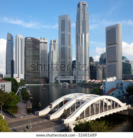 Skyline of Singapore financial district framed by Elgin Bridge and the Singapore River