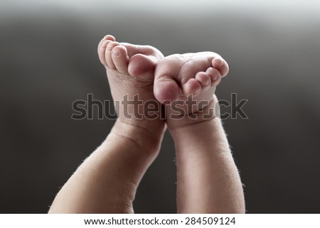 Baby feet in the air