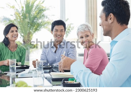 Similar – Image, Stock Photo Ethnic businesswoman eating sushi and working on laptop in cafe