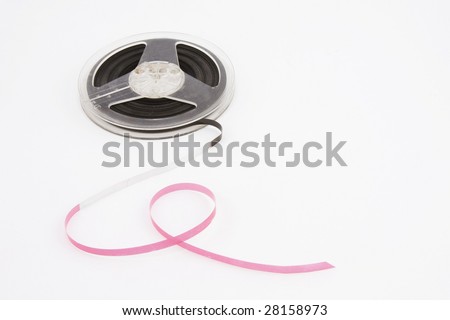 A spool of open reel magnetic tape on a white background