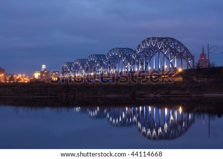 Night river with bridge and reflection