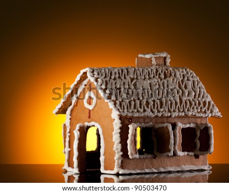 Gingerbread house on orange background