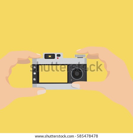 hands holding vintage camera