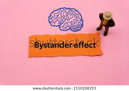 Bystander effect.The word is written on a slip of colored paper. Psychological terms, psychologic words, Spiritual terminology. psychiatric research. Mental Health Buzzwords. Stock foto © 