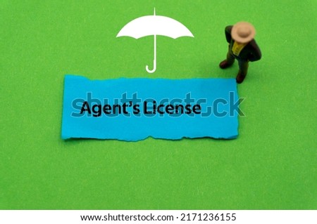 Agent's License.The word is written on a slip of colored paper. Insurance terms, health care words, Life insurance terminology. business Buzzwords. Stock fotó © 