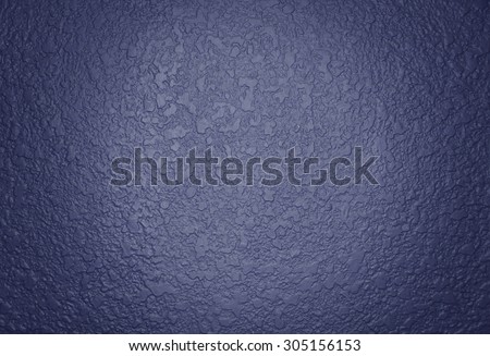 Dark violet paint textured wall closeup