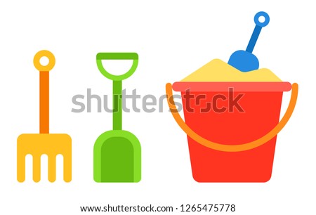 Red baby bucket with sand and shovel and rake for a sandbox next to it vertically vector flat icon isolated on white