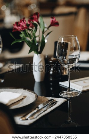 Similar – Image, Stock Photo Served banquet table with elegant decorations and plates with cutlery