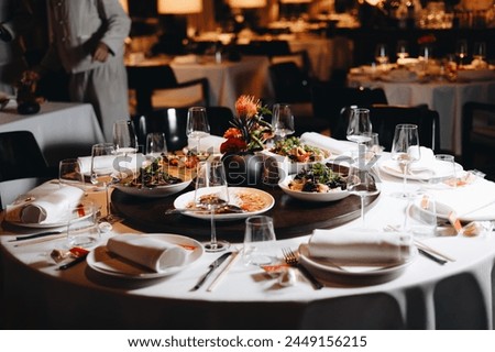 Similar – Image, Stock Photo Served banquet table with elegant decorations and plates with cutlery