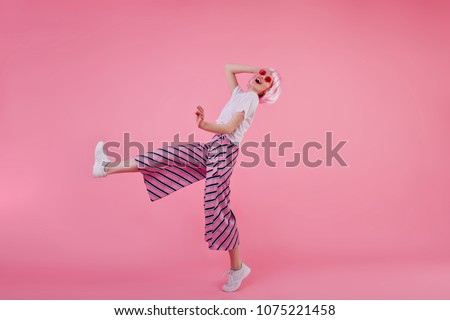 Similar – Image, Stock Photo Studio shot of trendy female sunglasses in coral tones for summer