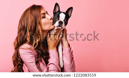 Similar – Image, Stock Photo Playful trendy woman on street in sunshine covering camera with hands