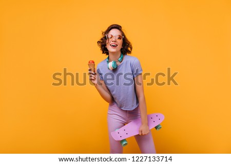 Similar – Image, Stock Photo Sportive woman in headphones using social media on smartphone