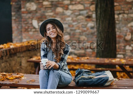 Similar – Image, Stock Photo Young woman in hat standing in garden