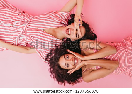 Similar – Image, Stock Photo Two stylish young girls portrait looking each other