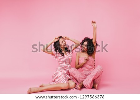 Similar – Image, Stock Photo Two stylish young girls portrait looking each other