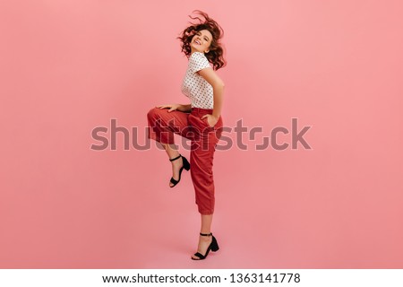 Similar – Image, Stock Photo Positive young female model in sportsclothes rides on blades enjoys leisure activities poses at urban place against blurred background stands in full length. Active lifestyle and rollerblading concept