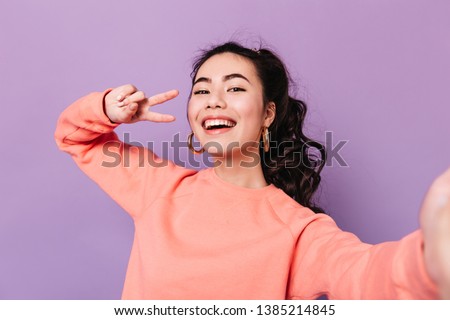 Similar – Image, Stock Photo Laughing women taking selfie on wooden bench at street