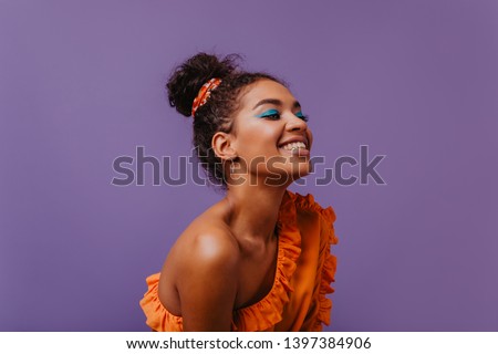 Similar – Image, Stock Photo Fun portrait of girl with her trendy white sweater over her head hiding, cold. Listening to music with headphones. Woman with tied hair. Photo in studio.