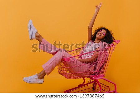 Similar – Image, Stock Photo carefree brunette woman lying on the floor laughing