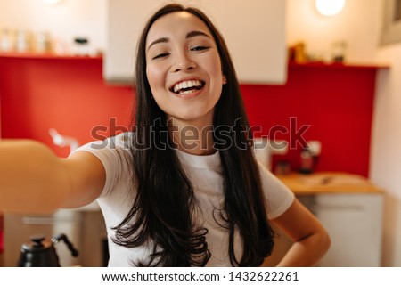 Similar – Image, Stock Photo Asian female taking selfie in underground passage