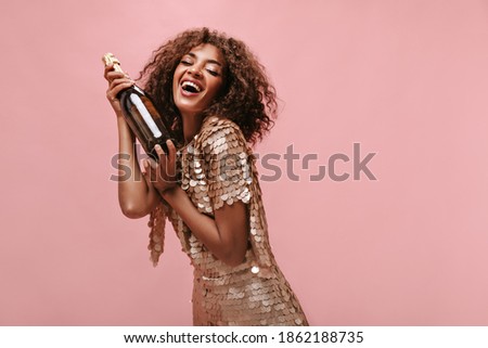 Similar – Image, Stock Photo Bottle of champagne face mask and glasses with gold glitter on pink background. Party decor. Christmas, birthday or wedding concept. Flat lay. Festive, drink. New year 2021 celebration.