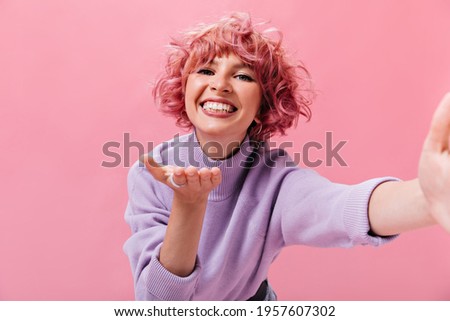 Similar – Image, Stock Photo Woman with purple hair leaning on metal fence and looking away