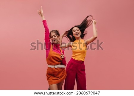 Similar – Image, Stock Photo Group of friends jumping and tossing ball up