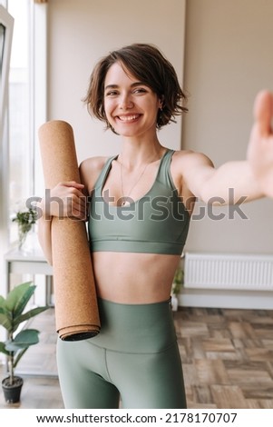 Similar – Image, Stock Photo Smiling woman dressed sportswear with rolled pilates mat in a park
