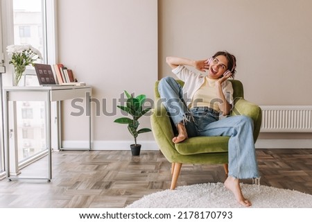 Similar – Image, Stock Photo Young woman with short brunette hair looks out the window behind the glass