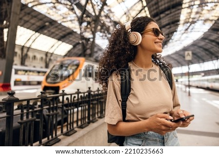 Similar – Image, Stock Photo Woman with headphones before working out in park