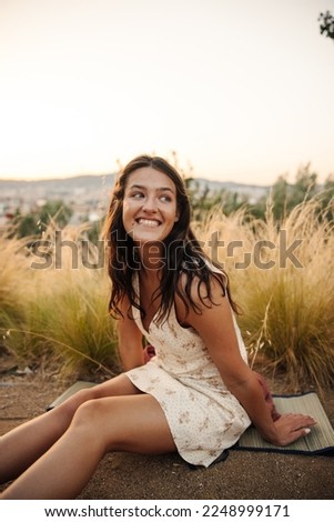 Similar – Image, Stock Photo Relaxed woman in sundress enjoying view on bridge across wide river