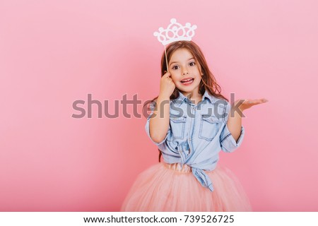 Similar – Image, Stock Photo Amazed happy little girl unwrapping birthday present party at home