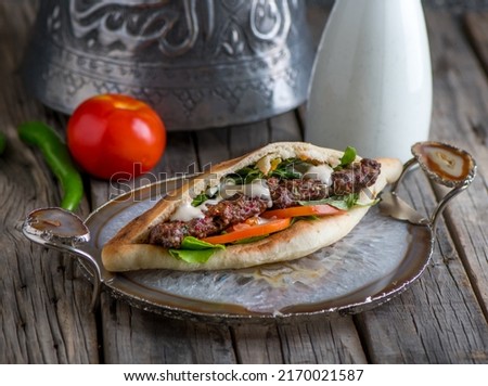 kebab sandwich served in dish side view on wooden table background Zdjęcia stock © 