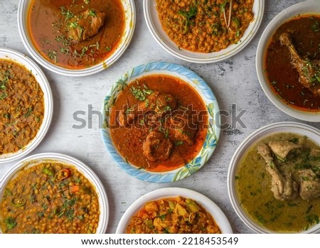 chicken or beef red karahi, daal moong, mash, chana, channay, korma, nihari, fry, makhni, qeema,white karahi served in a plate isolated on table top view of indian and assorted pakistani desi food Foto d'archivio © 
