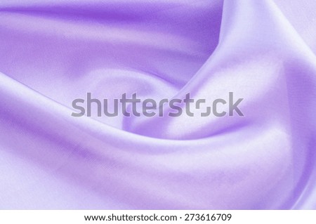 Lining texture, satin, lilac. Abstract image of purple paper rolls