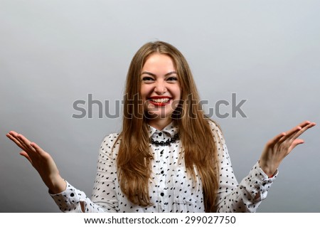 portrait of woman happy, win, victory, smiling and posing isolated on grey background