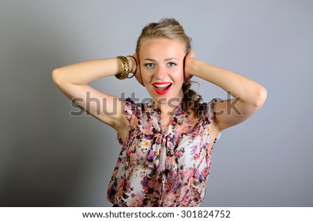 woman stretching and relaxing after long working hours, closing her ears